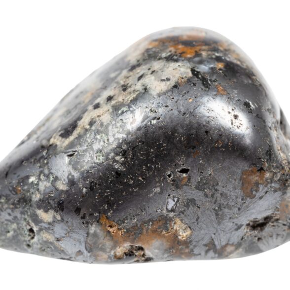 close up of sample of natural stone from geological collection - tumbled cleiophane and mushketovite rock isolated on white background from Karelia